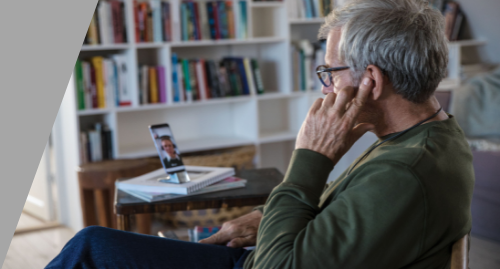 Man getting online hearing aid support with smartphone.