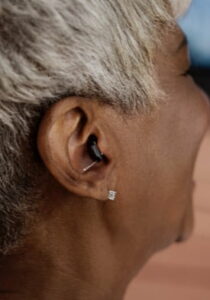 Sony C10 CIC hearing aid worn in right ear.