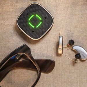 Widex Sound Assist on canvas with glasses and hearing aids